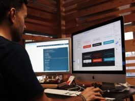 Four Things To Look Out For When Hiring A Website Designer man using Apple computer