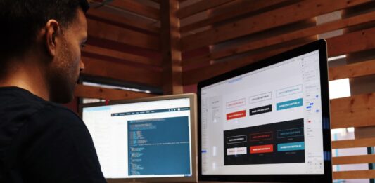 Four Things To Look Out For When Hiring A Website Designer man using Apple computer