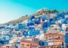 Bitcoin Investment Progress for this Decade in Morocco blue and white painted houses on the cliff