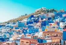 Bitcoin Investment Progress for this Decade in Morocco blue and white painted houses on the cliff