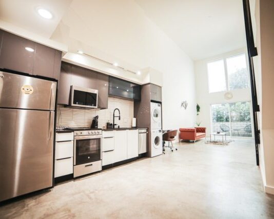 Avoiding Common Appliance Mistakes brown wooden kitchen cabinet near white wall