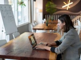 ISO 9001 Internal Audit Training Online: Enhance Your Quality Management Skills woman in gray and white striped long sleeve shirt using silver macbook