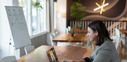ISO 9001 Internal Audit Training Online: Enhance Your Quality Management Skills woman in gray and white striped long sleeve shirt using silver macbook