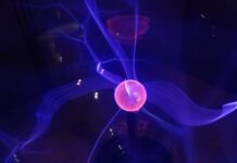 The Impact of Quantum Computing on Cosmos (ATOM) red ball with purple aura digital wallpaper