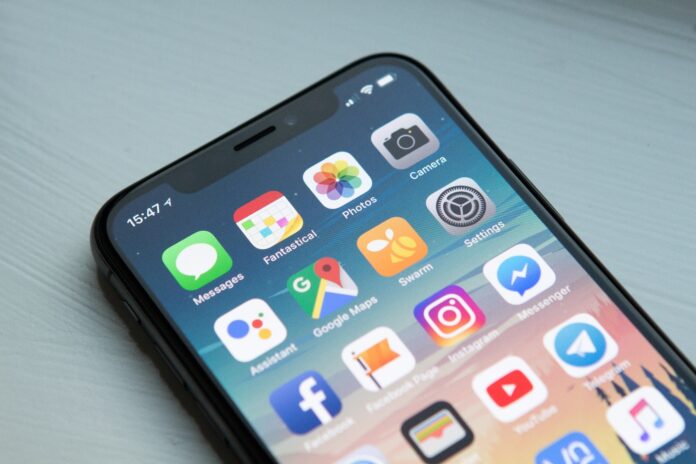 a-cell-phone-with-apps-on-the-screen-description A cell phone with apps on the screen Description automatically generated