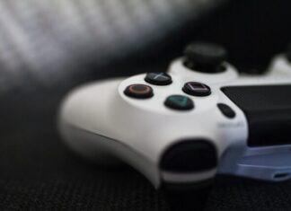 Level up Your Video Game Art: 5 Expert Tips to Follow closeup of white Sony PS4 controller