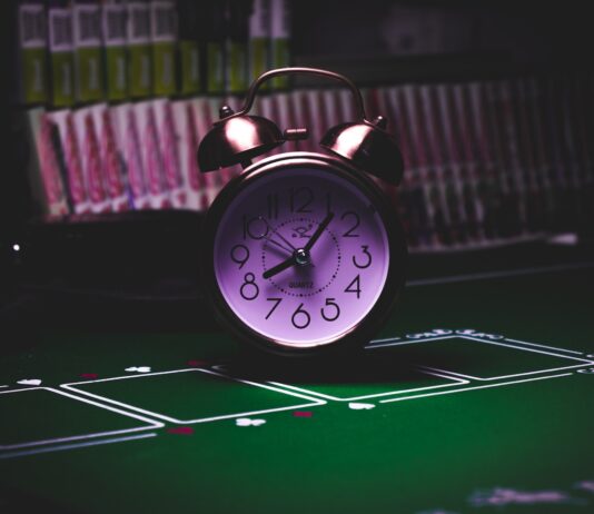 The Ethical Debate Surrounding Casino Bonuses silver twin bell alarm clock on green table