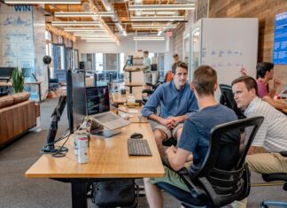 Evaluating the Role of ML in Driving Insurtech Innovation three men sitting on chair beside tables