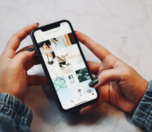 How to stay connected with your loved ones while exploring the world person holding white iphone 5 c