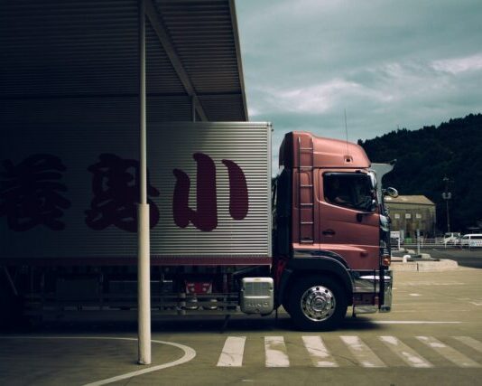 Are You Making These Trucking Company Mistakes? box truck passing through toll gate