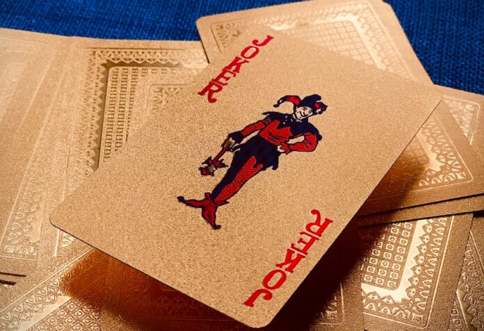 Photo by Stephan Coudassot beige Joker playing card lot