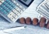 Retirement Calculator Roadmap: Planning for a Stress-Free Retirement. a calculator, pen, and money on a table