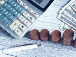 Retirement Calculator Roadmap: Planning for a Stress-Free Retirement. a calculator, pen, and money on a table