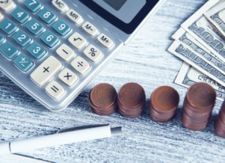 Retirement Calculator Roadmap: Planning for a Stress-Free Retirement. a calculator, pen, and money on a table