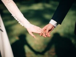 Demystifying Marriage Green Card Income Criteria: Your Complete Handbook man and woman holding hands focus photo