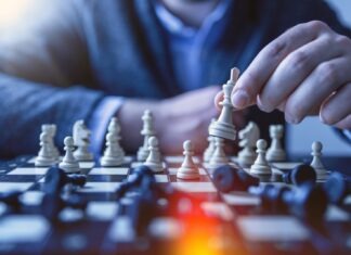 Enhancing Emotional Intelligence, Resilience, and Confidence in Students through Mathematics Education depth of field photography of man playing chess