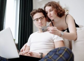 What Happens If You Lose a Credit Dispute? Man Typing Credit Card Details