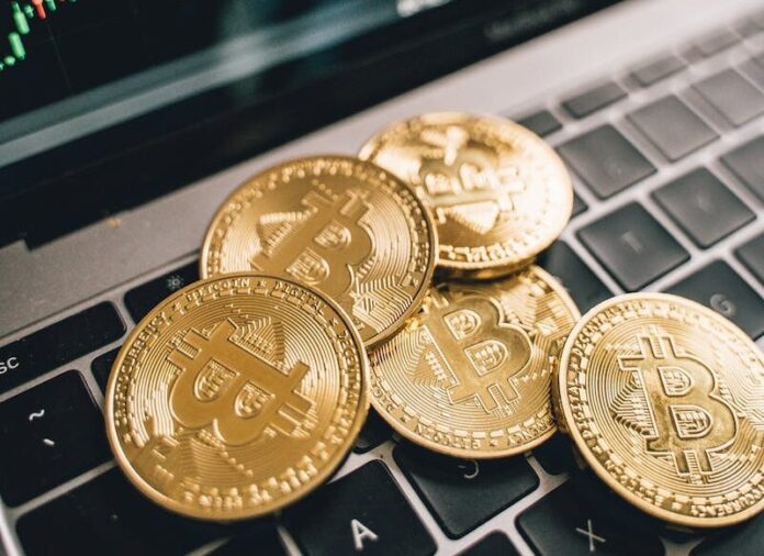 Photo by Alesia Kozik Gold Coins on the Laptop