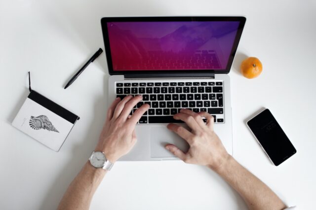 Photo by NordWood Themes person using laptop computer