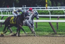 Why a Day at the Races is Good For the Soul two man riding horse while racing