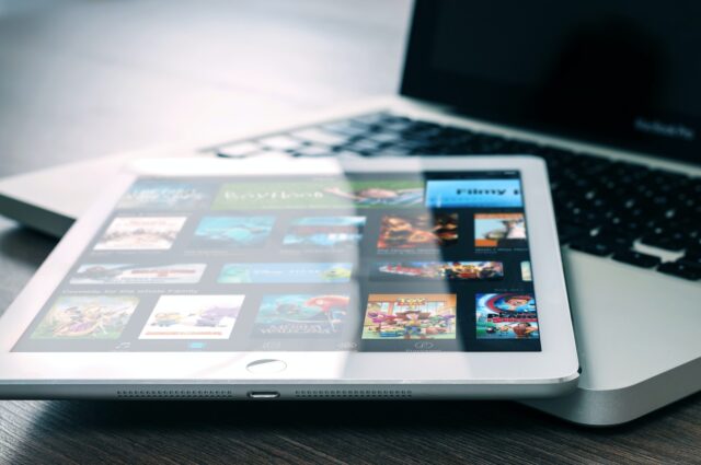 Photo by Firmbee.com silver iPad on top of MacBook Pro