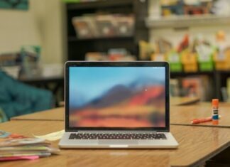 The Role of Virtual Assistants in Streamlining Business Operations macbook pro on brown wooden table