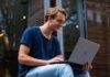 The Role of Smart Contracts in CBDC Ecosystems Selective Focus Photo of Man Using Laptop