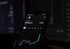 Bitcoin Wallets: Safeguarding Against Risks a cell phone displaying a stock chart on the screen