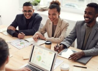 From Capitol Hill To Wall Street: Dennis Bonnen Explores The Influence of Political Internships on Business Careers Photo of Three People Smiling While Having a Meeting