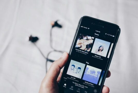 Spotify Batch Downloading: A Guide For Music Lovers person holding iPhone 6 turned on