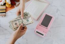 Fixed vs. Variable Interest Rates: What’s Best For Your Bank Loan? Hands Holding Dollars