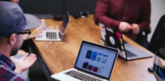 Types of Risks Faced by a Business in 2024 man talking in the meeting