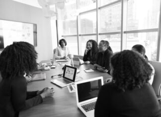 Tech Trends Analysis: Anticipating Market Shifts with Product Intelligence people sitting beside rectangular table beside window