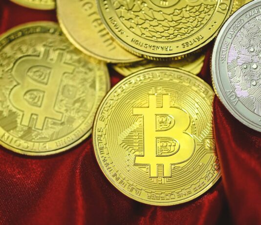 Crypto Confidential: Balancing Anonymity and Transparency in Bitcoin Gambling a pile of bitcoins sitting on top of a red cloth