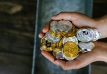 Foreseeing the Bitcoin’s Role in the Integration of Digital Currencies Person Holding Gold and Silver Coins