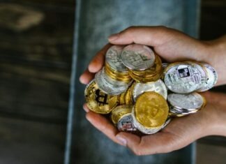 Foreseeing the Bitcoin’s Role in the Integration of Digital Currencies Person Holding Gold and Silver Coins