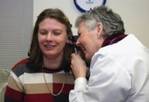 Guide to ENT Treatments: A Closer Look at Procedures and Conditions a woman talking on a cell phone next to a man