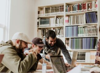 Tips for Having Fun During Your Downtime in College a group of people looking at a book