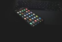The Future of Mobile App Development: Trends to Watch black iphone 5 on black computer keyboard