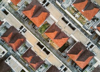 Real Estate Agents and Their Role in Urban Planning areal photography of brown building