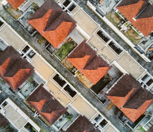 Real Estate Agents and Their Role in Urban Planning areal photography of brown building