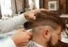The Importance of Grooming with Stylish Haircuts: Enhancing Confidence and Self-Expression man in white dress shirt cutting hair of man