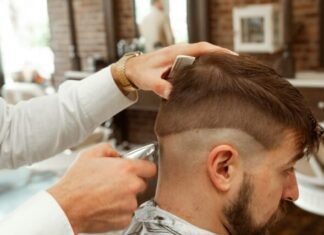 The Importance of Grooming with Stylish Haircuts: Enhancing Confidence and Self-Expression man in white dress shirt cutting hair of man