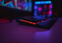 How to Improve Your Rust Gaming Experience black computer keyboard on brown wooden table