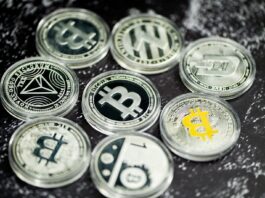 How to Choose the Right Bitcoin Miner Hosting Plan a pile of bitcoins sitting on top of a table