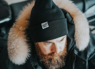 Stay Cosy, Stay Seen: How Branded Beanies Keep Your Business Top of Mind a man with a beard wearing a black hat