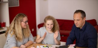 A New Era of Education: The Future of Online Learning 2 girls sitting at the table