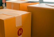 Factors That Affect Your Final Shipping Price Cardboard containers sealed with sticky tape for relocation placed near window on sunny day