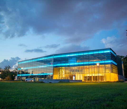 Innovative Applications for Power Tracks in Modern Work Environments white and blue building under cloudy sky during daytime