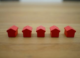 Top Mistakes to Avoid When Filing a Homeowners Insurance Claim red blocks on brown wooden table